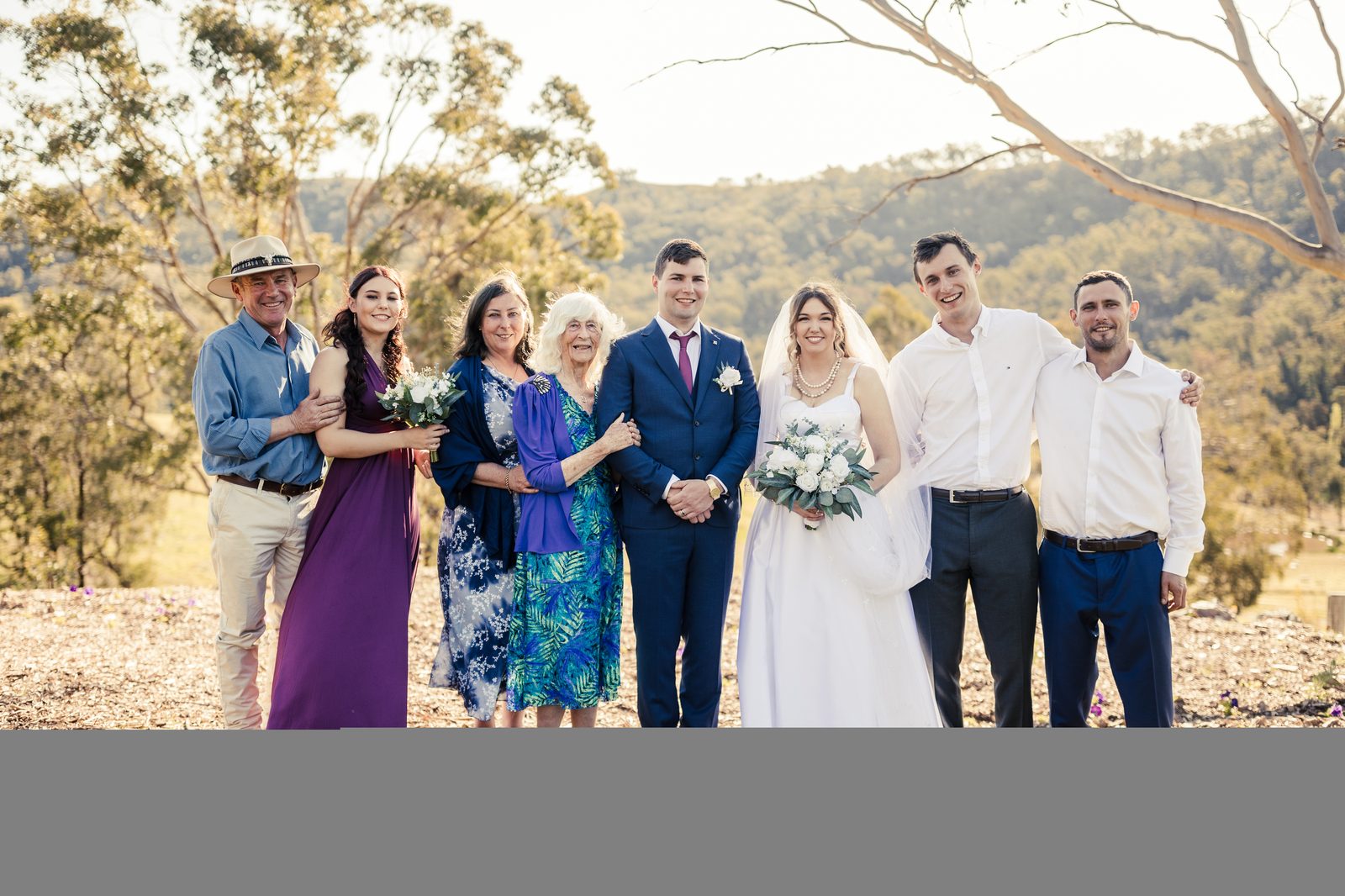 The Rumble and Blaxland family at Springcart Farm in golden hour, Tristan and Brittany's wedding, 2022